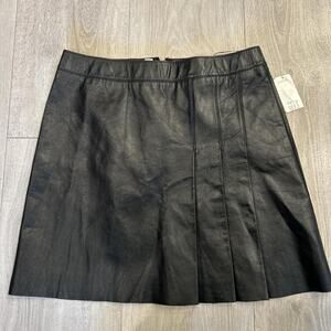 NWT DKNY black leather pleated mini skirt. Size petite 10
